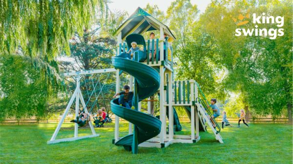 The Galaxy vinyl playset for sale in Denton, MD. Pictured in lush green backyard.