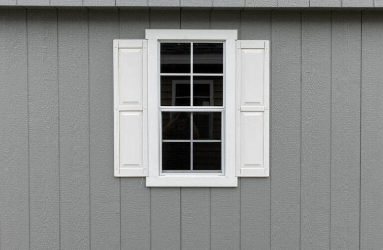 White window and shutter on gray wall