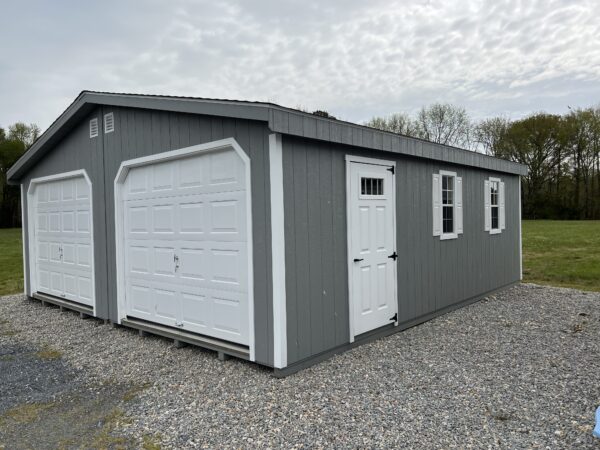 Gray and white Amish built 2 car prefab garage for sale in Denton, MD