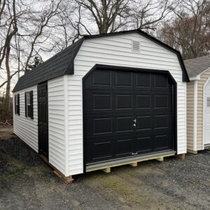 A black and white storage shed