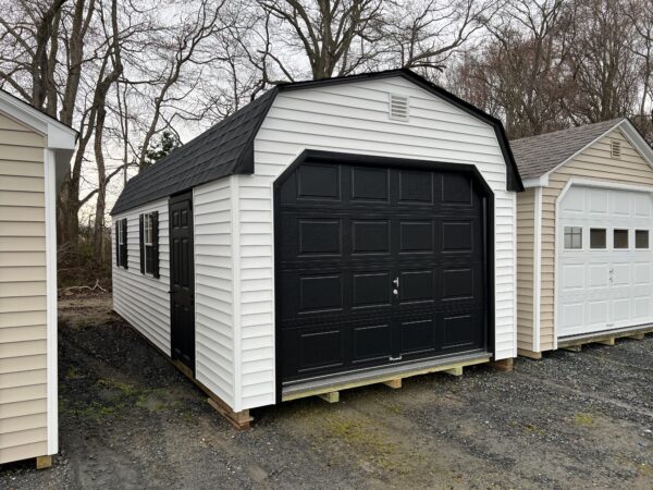 A black and white storage shed