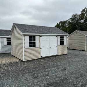 Ivory and white storage shed for sale in Denton, MD