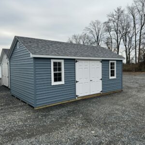 Blue and white storage shed for sale in Denton, MD