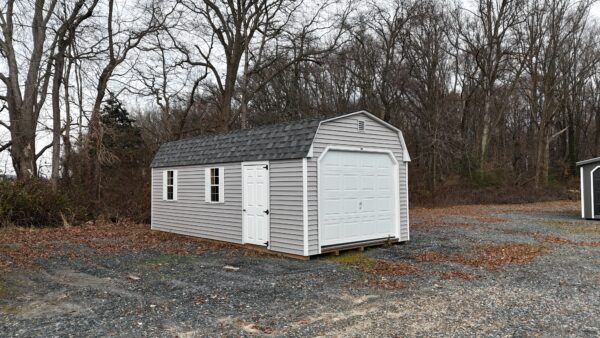 Gray and white 1 car garage mini barn for sale in Denton MD