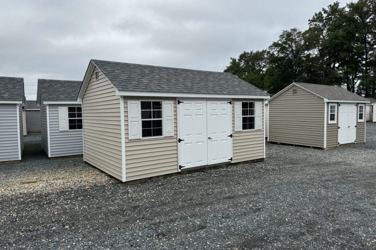 Ivory and white storage shed for sale in Denton, MD