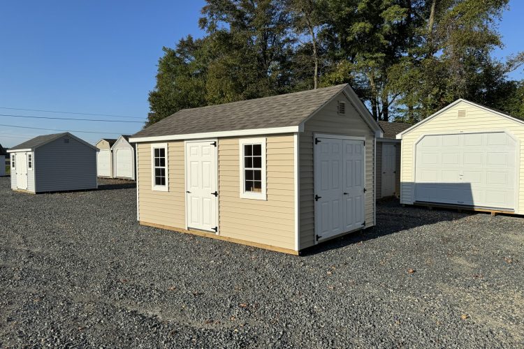 Tan and white storage shed for sale in Denton, MD