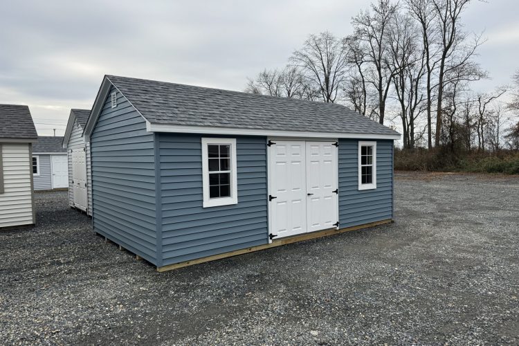 Blue and white storage shed for sale in Denton, MD