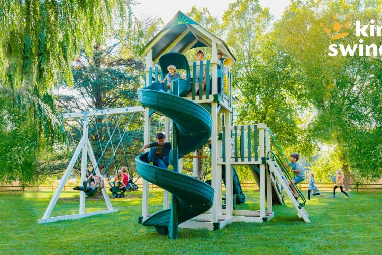 The Galaxy vinyl playset for sale in Denton, MD. Pictured in lush green backyard.